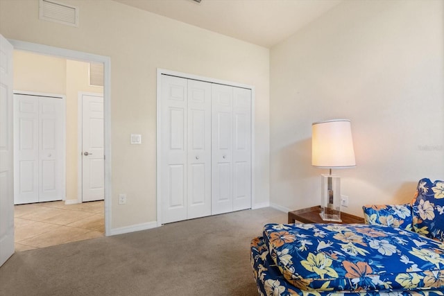 carpeted bedroom with a closet