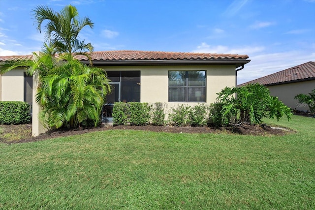 view of home's exterior featuring a lawn