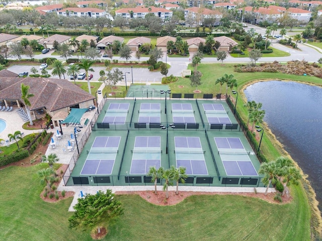 birds eye view of property featuring a water view