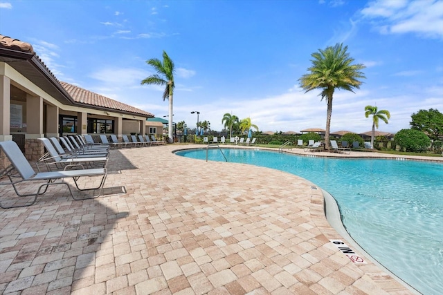 view of swimming pool featuring a patio area