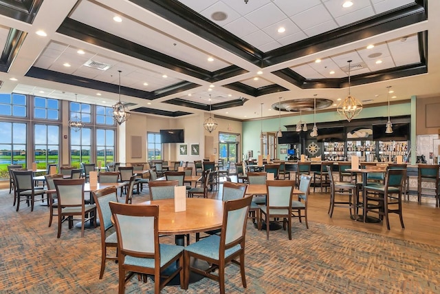 dining room featuring a high ceiling, coffered ceiling, and beam ceiling