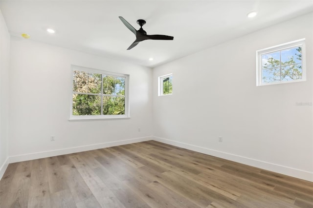 empty room with light hardwood / wood-style flooring and ceiling fan