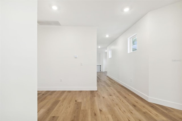 spare room featuring light hardwood / wood-style flooring