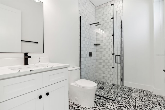 bathroom featuring tile patterned flooring, vanity, toilet, and a shower with door