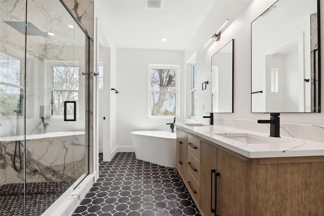 bathroom featuring plus walk in shower and vanity