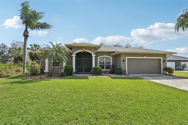 view of front of home featuring a front lawn and a garage