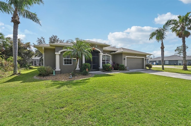 view of front facade with a front yard and a garage