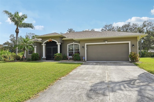 view of front facade featuring a front yard and a garage