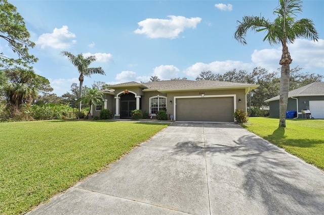 view of front facade featuring a front yard and a garage