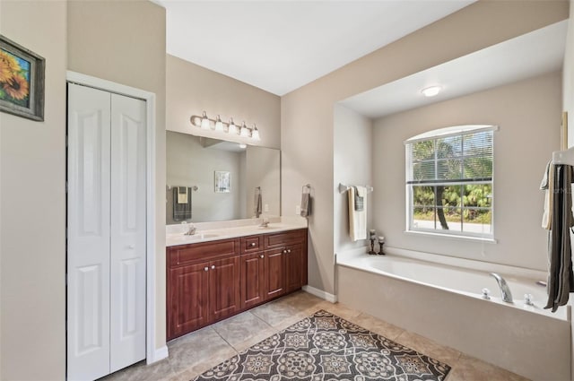 bathroom featuring vanity, a tub, and tile patterned floors