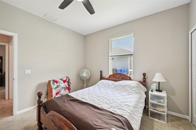 carpeted bedroom featuring ceiling fan