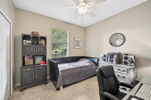 carpeted bedroom with ceiling fan