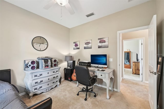 office area featuring light carpet and ceiling fan