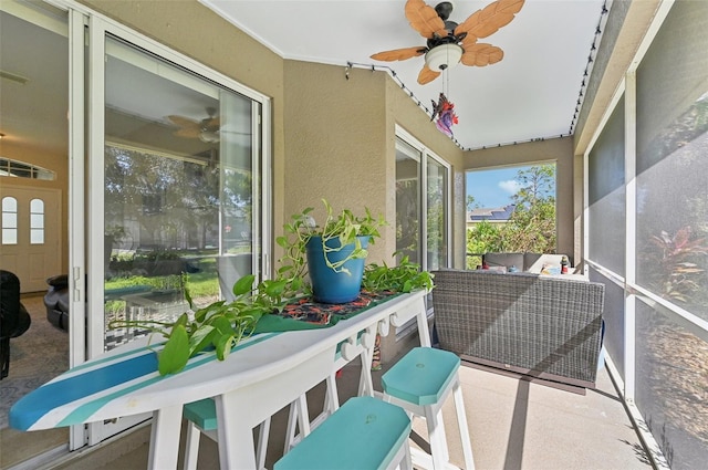 sunroom / solarium with ceiling fan