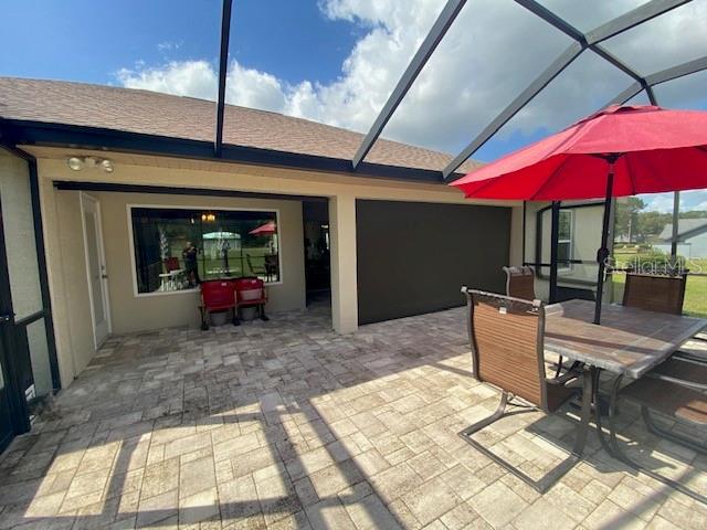 view of patio / terrace with a lanai