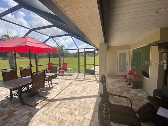 view of patio / terrace with a lanai