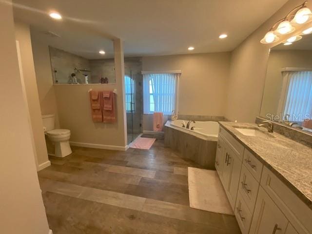 full bathroom with vanity, toilet, and shower with separate bathtub