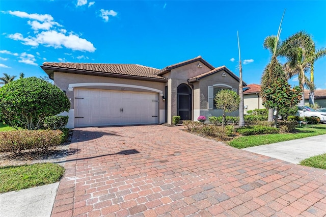 mediterranean / spanish-style house featuring a garage