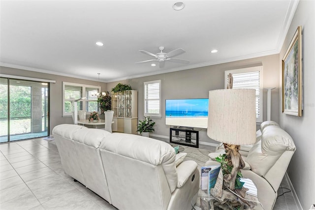 tiled living room with ceiling fan and crown molding