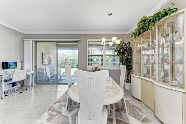 dining area with a chandelier and ornamental molding