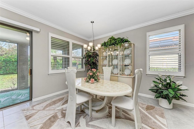 dining space featuring crown molding, plenty of natural light, light tile patterned floors, and a chandelier