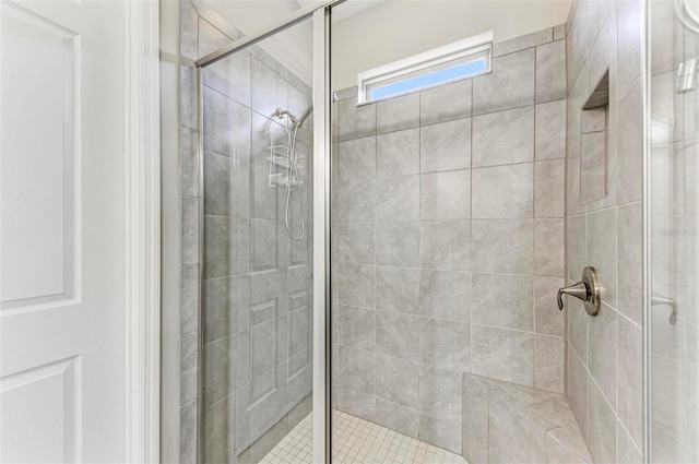 bathroom with a shower with shower door