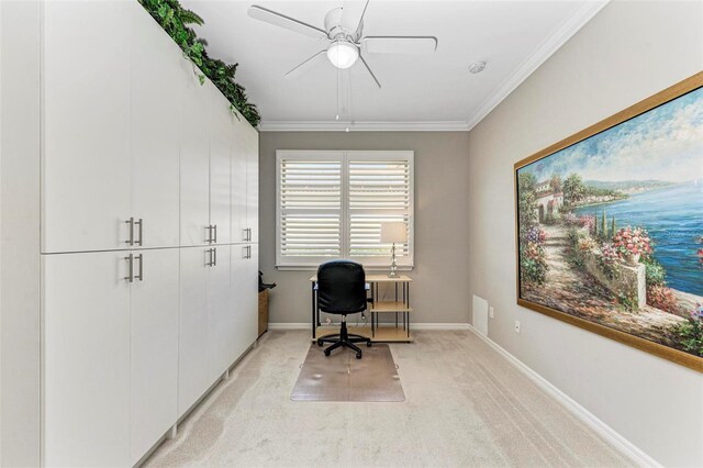 carpeted office space with ceiling fan and crown molding