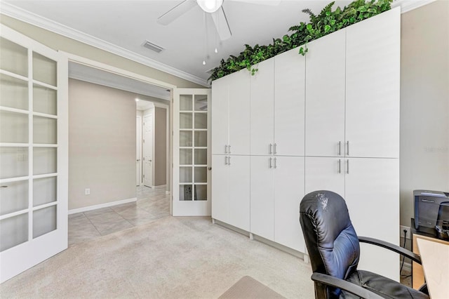 carpeted office featuring ceiling fan, crown molding, and french doors