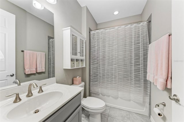 full bathroom featuring shower / bathtub combination with curtain, tile patterned flooring, vanity, and toilet