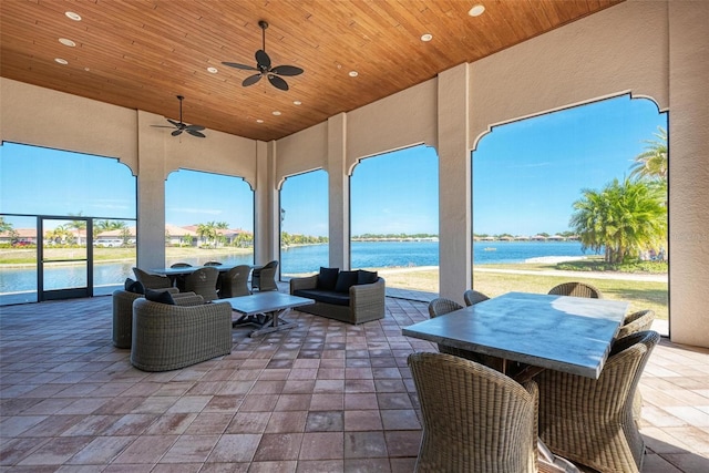 view of patio featuring an outdoor hangout area, a water view, and ceiling fan