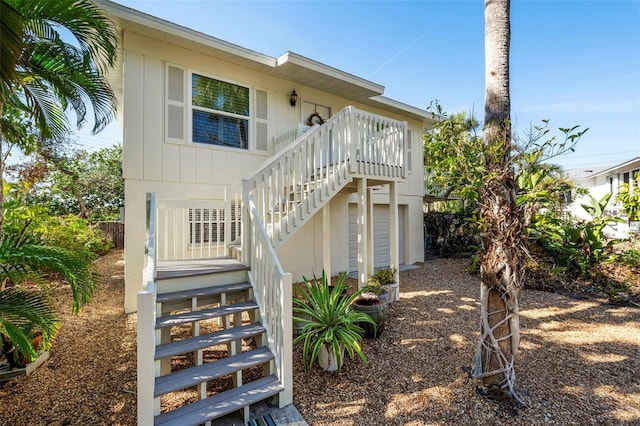 back of property with covered porch