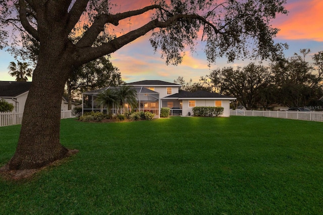 yard at dusk with glass enclosure