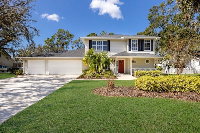 view of front of house with a front lawn and a garage