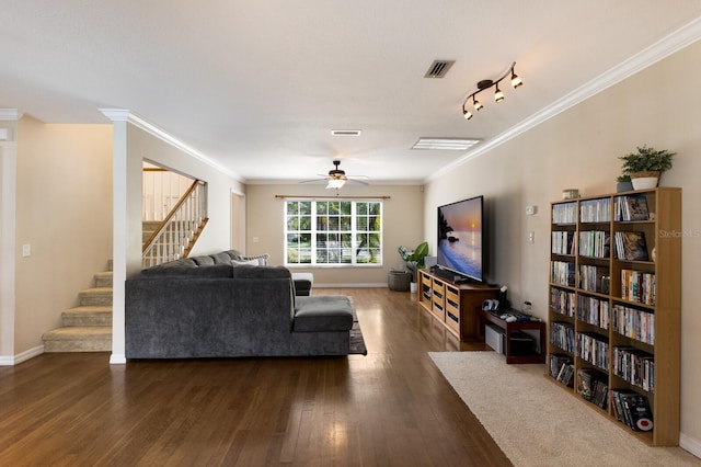 living room with crown molding, track lighting, ceiling fan, and dark hardwood / wood-style flooring