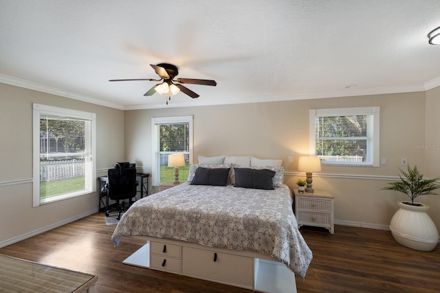 bedroom featuring dark hardwood / wood-style flooring, multiple windows, crown molding, and ceiling fan