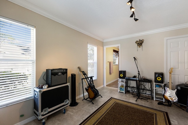 workout room with ornamental molding and a healthy amount of sunlight