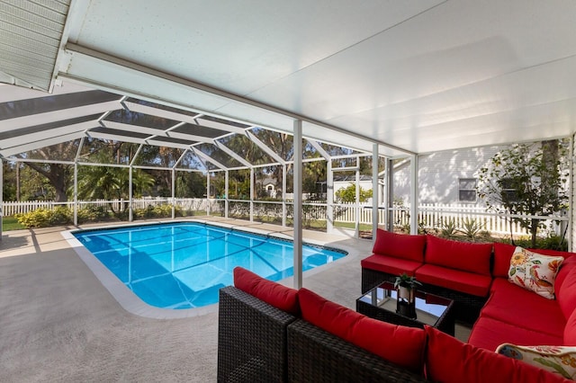 view of pool featuring a patio, an outdoor living space, and a lanai