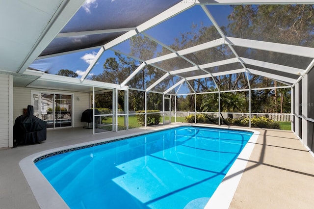 view of pool featuring a patio, a lanai, and area for grilling