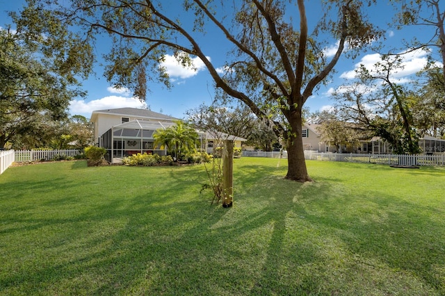 view of yard with a lanai