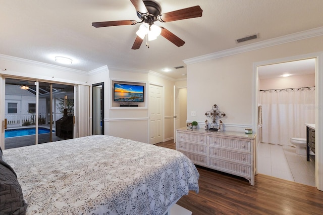 bedroom featuring access to exterior, ensuite bath, ornamental molding, ceiling fan, and dark hardwood / wood-style flooring