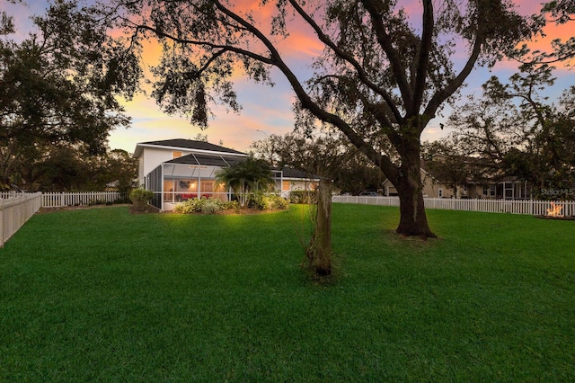 yard at dusk with a lanai