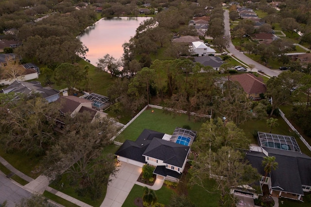 aerial view at dusk with a water view