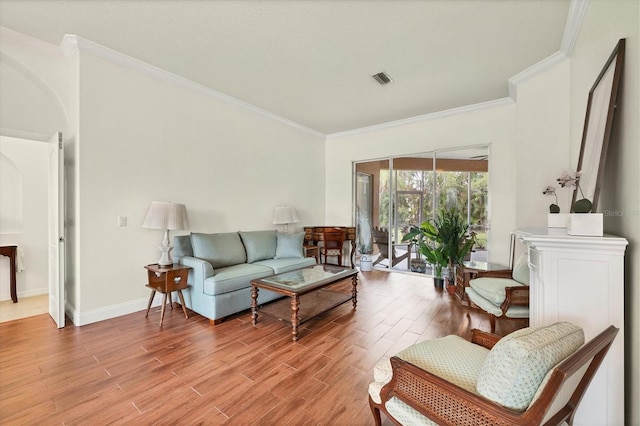 living area featuring ornamental molding and wood-type flooring