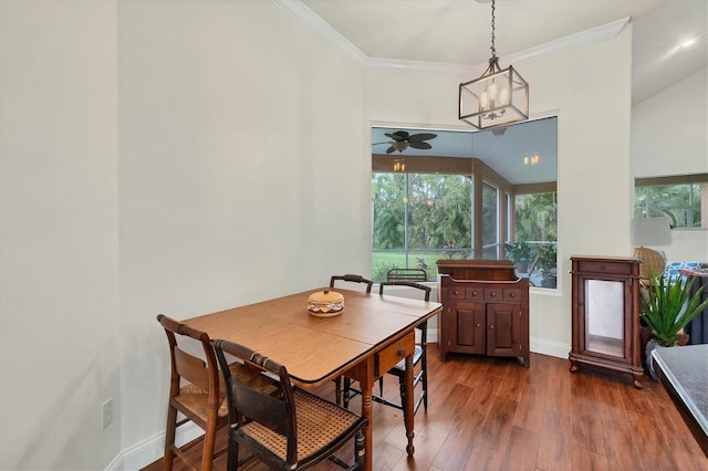 dining space featuring crown molding, dark hardwood / wood-style floors, and ceiling fan with notable chandelier