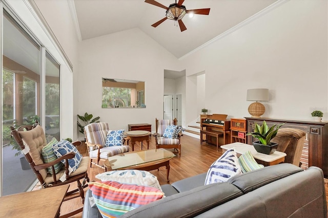 7341 Featherstone Blvd, Sarasota, FL 34238 - living area with ceiling fan, wood finished floors, high vaulted ceiling, and crown molding