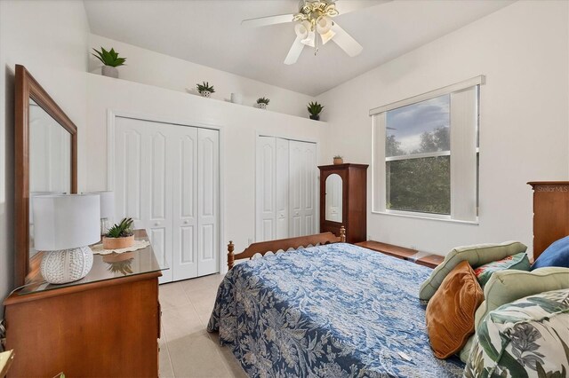 7341 Featherstone Blvd, Sarasota, FL 34238 - bedroom with multiple closets, light tile patterned floors, and a ceiling fan