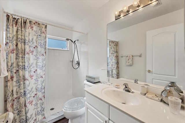 bathroom with vanity, a shower with curtain, and toilet