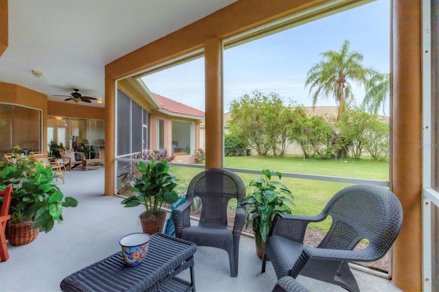 sunroom / solarium with ceiling fan