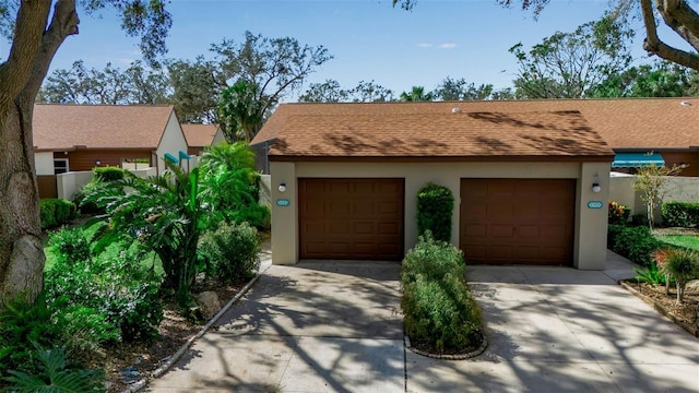 ranch-style house featuring a garage