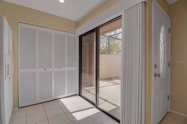 entryway featuring light tile patterned floors